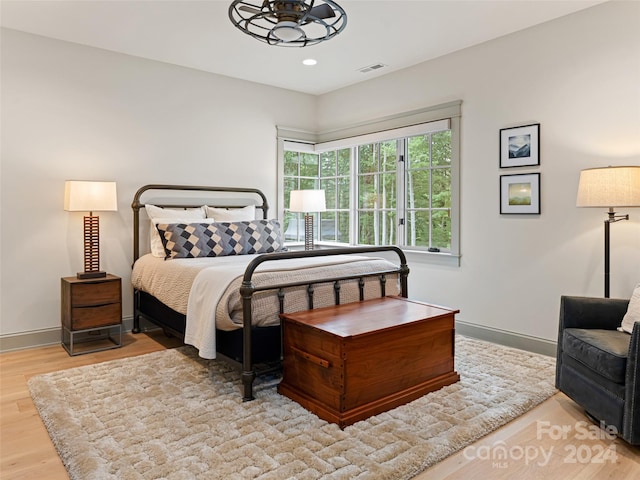 bedroom with light wood-type flooring