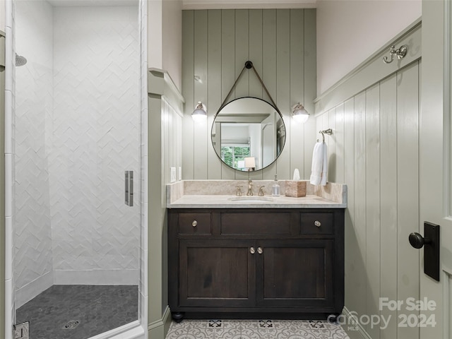 bathroom featuring vanity and an enclosed shower