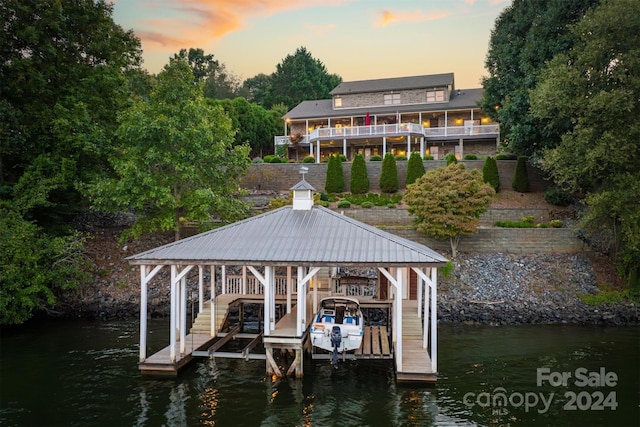 view of dock with a water view and boat lift