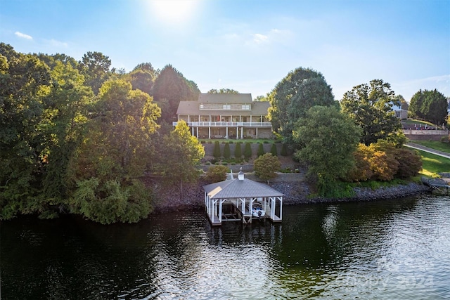 dock area with a water view and boat lift