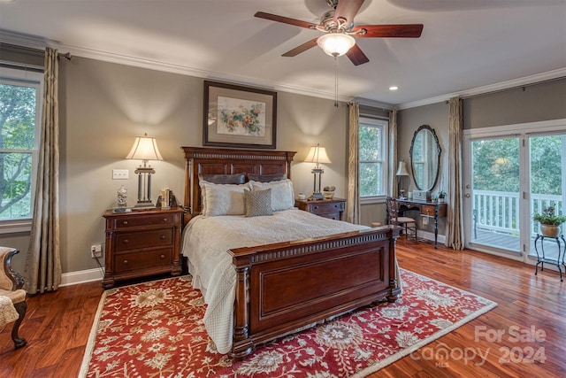 bedroom with baseboards, wood finished floors, ornamental molding, and access to outside