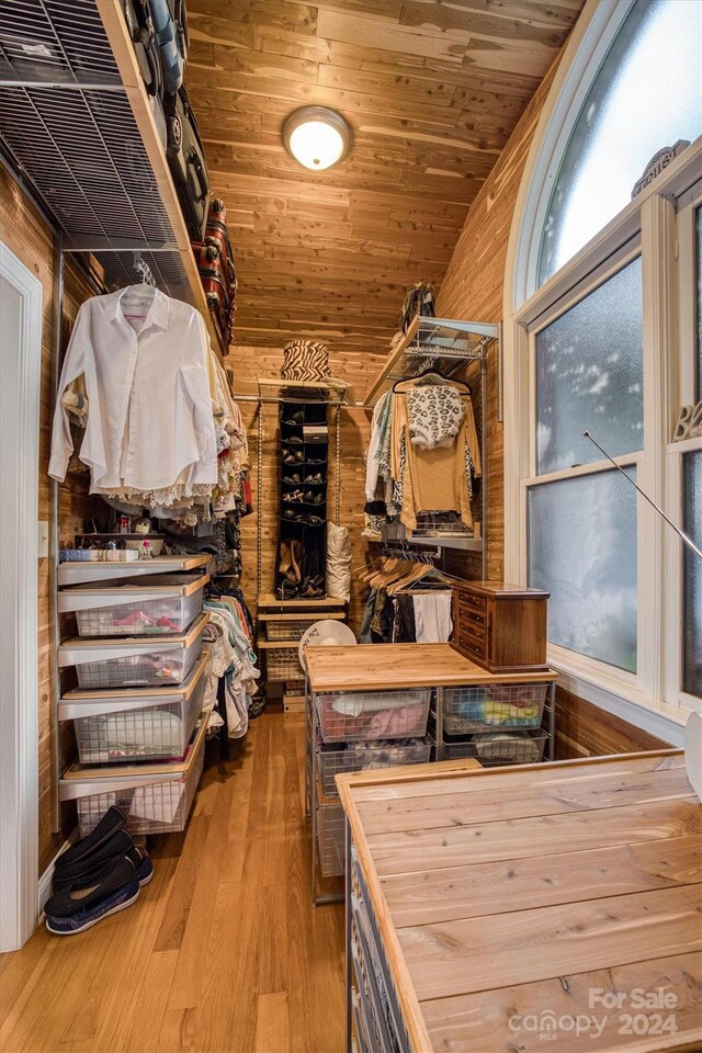 interior space with lofted ceiling and wood finished floors