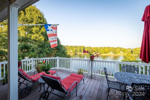 deck featuring a water view