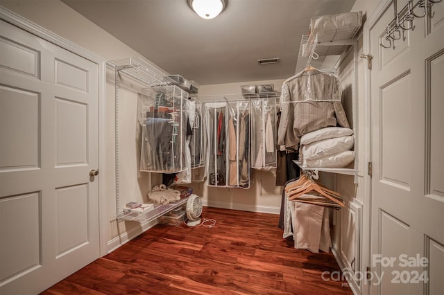 spacious closet featuring visible vents and wood finished floors