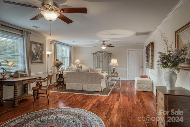 living room featuring visible vents, wood finished floors, and crown molding