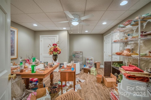 interior space with recessed lighting, a drop ceiling, a ceiling fan, and light wood finished floors