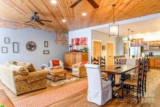 dining space with wooden ceiling, light wood-type flooring, and ceiling fan