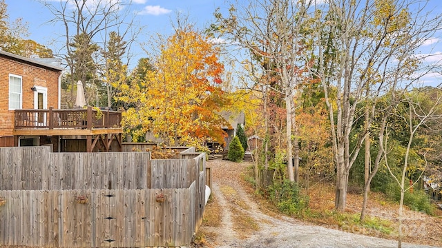 view of yard with a wooden deck