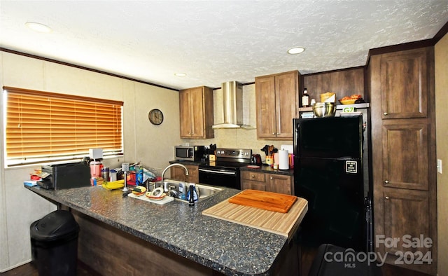 kitchen featuring wall chimney exhaust hood, a textured ceiling, stainless steel appliances, and sink