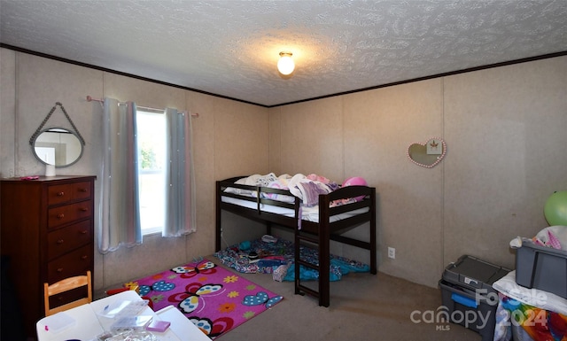 bedroom featuring a textured ceiling and carpet floors