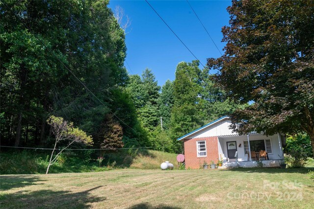 view of yard with covered porch