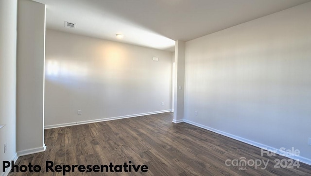 unfurnished room featuring dark hardwood / wood-style floors