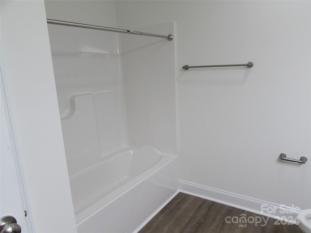 bathroom with hardwood / wood-style floors