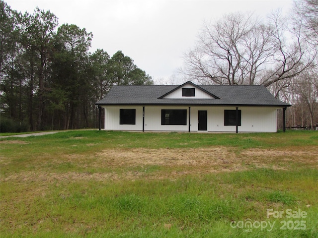 view of outdoor structure with a yard