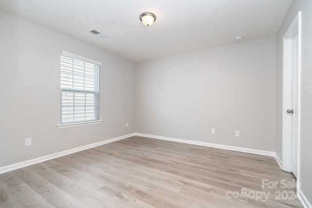 spare room with light wood-type flooring