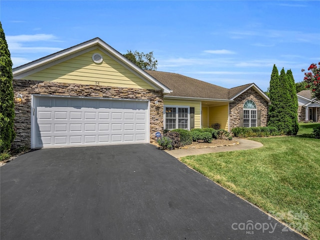 single story home with a garage and a front yard