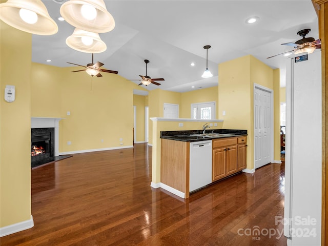 kitchen with dishwasher, sink, dark hardwood / wood-style flooring, ceiling fan, and a premium fireplace