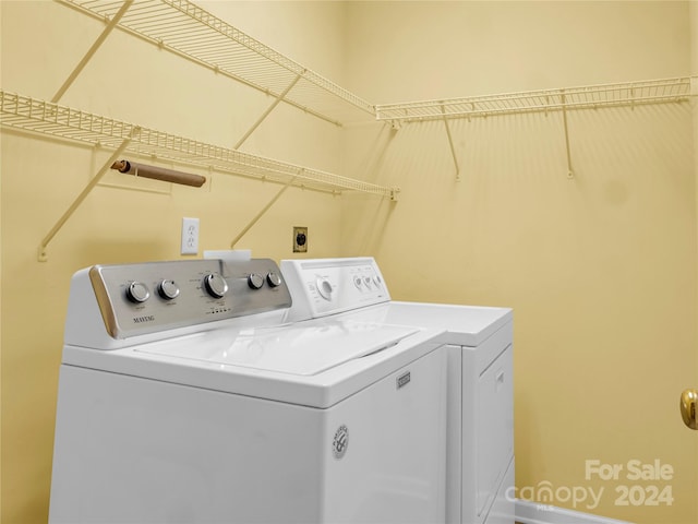 washroom with washer and dryer