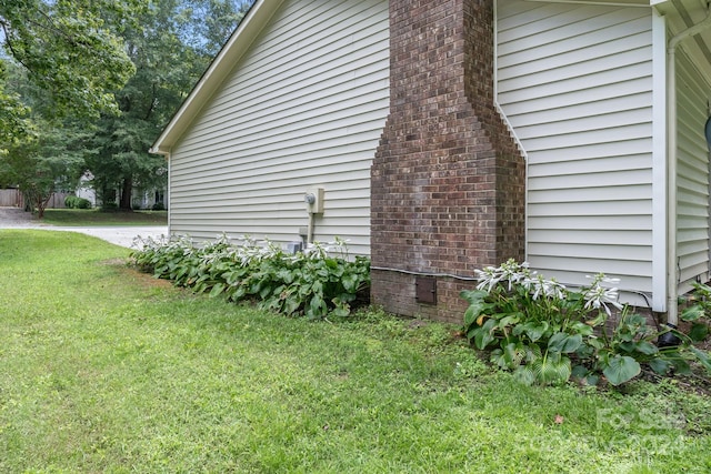 view of property exterior featuring a yard