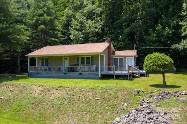 view of front of property with a porch and a front yard