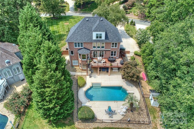 view of swimming pool featuring a patio area and a fenced in pool