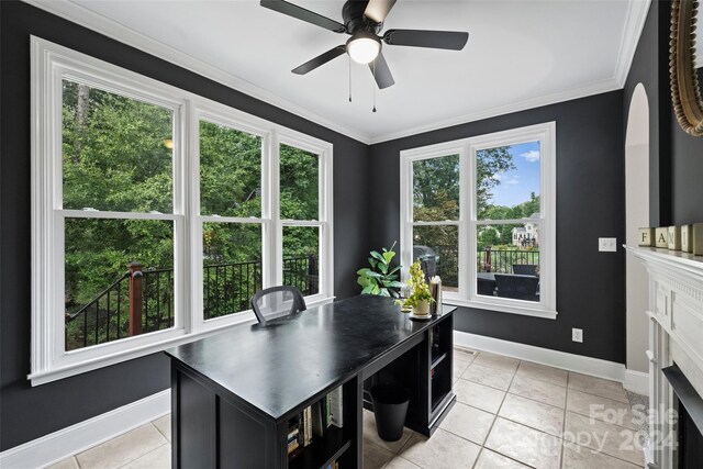 office space featuring a ceiling fan, light tile patterned floors, baseboards, and crown molding