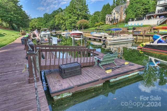 view of dock featuring a water view and boat lift