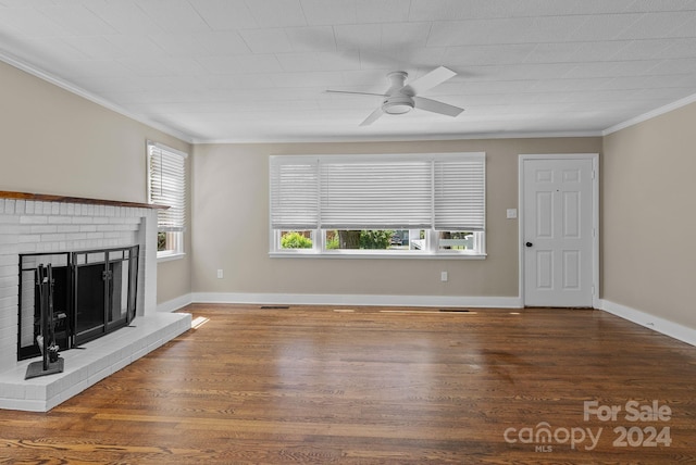 unfurnished living room featuring ceiling fan, ornamental molding, hardwood / wood-style floors, and a fireplace