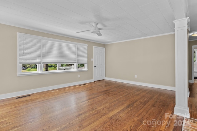 unfurnished room featuring ornate columns, ceiling fan, hardwood / wood-style flooring, and ornamental molding