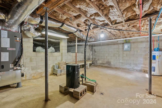 basement featuring electric water heater, heating unit, and electric panel