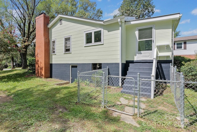 back of house with a yard