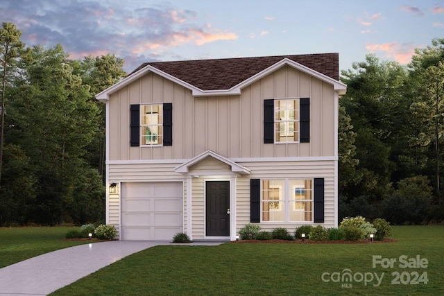 view of front of house featuring a yard, a shingled roof, an attached garage, board and batten siding, and driveway