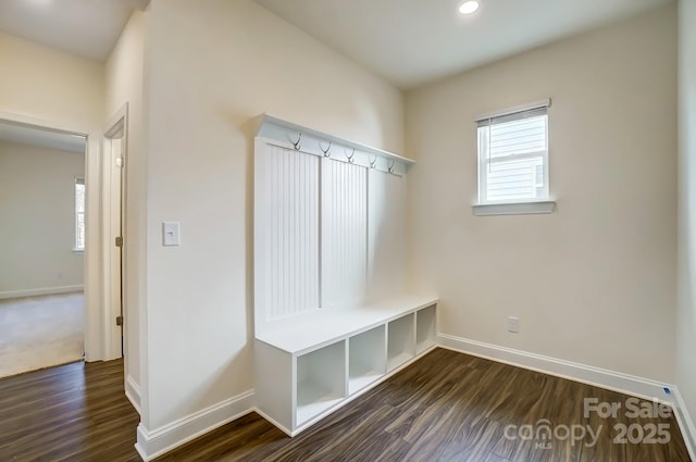 mudroom featuring baseboards, dark wood-type flooring, and recessed lighting