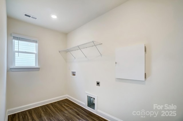 clothes washing area with laundry area, visible vents, dark wood finished floors, baseboards, and washer hookup