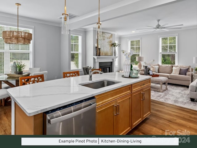 kitchen with pendant lighting, a kitchen island with sink, dark hardwood / wood-style floors, and stainless steel dishwasher