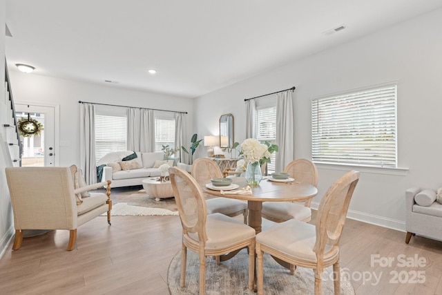 dining room with light wood-type flooring