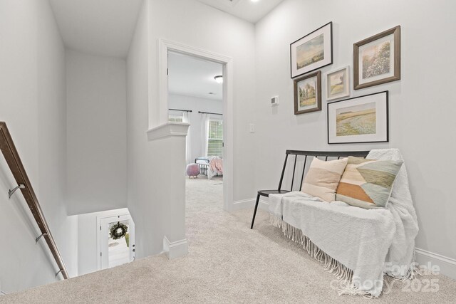 sitting room with light colored carpet