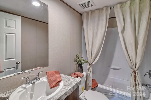 full bathroom with shower / tub combo, vanity, toilet, and ornamental molding