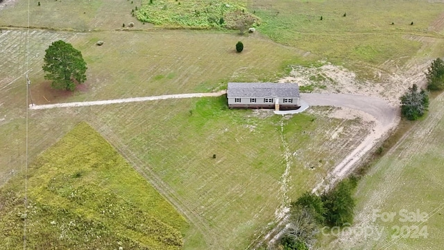 birds eye view of property with a rural view