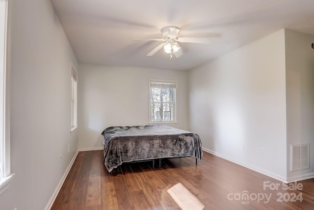 bedroom featuring ceiling fan and wood-type flooring