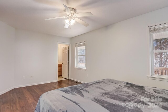 bedroom featuring ceiling fan and dark wood-type flooring