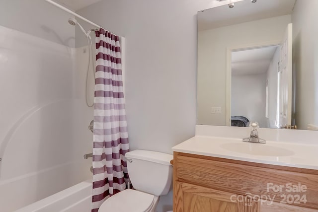 full bathroom featuring toilet, vanity, and shower / bath combo