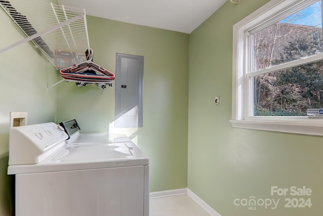 clothes washing area featuring washer and dryer and electric panel