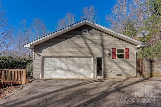 view of side of home with a garage