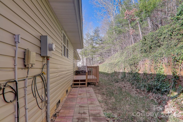 view of side of property featuring a deck