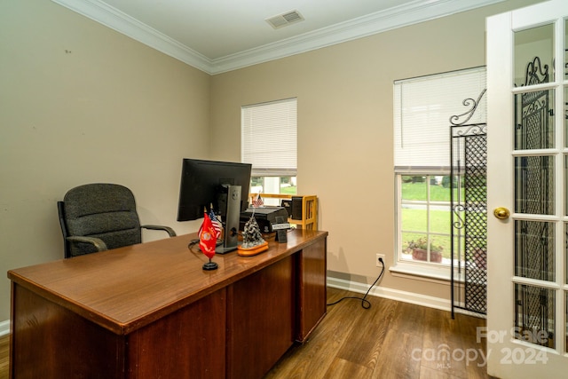 home office featuring wood-type flooring, plenty of natural light, and crown molding