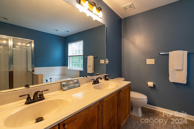 full bathroom featuring shower with separate bathtub, tile patterned floors, vanity, and toilet