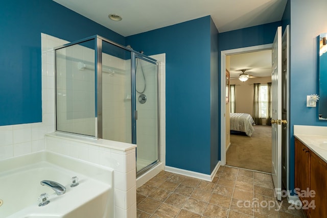 bathroom with ceiling fan, vanity, and plus walk in shower