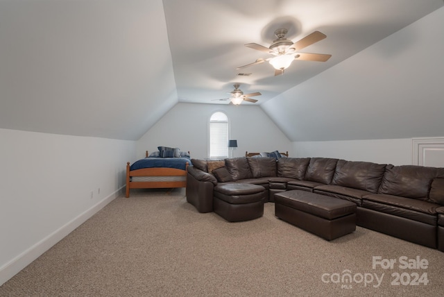 carpeted living room featuring ceiling fan and vaulted ceiling