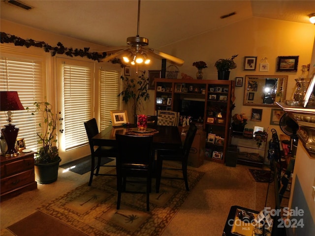 dining space with vaulted ceiling and ceiling fan